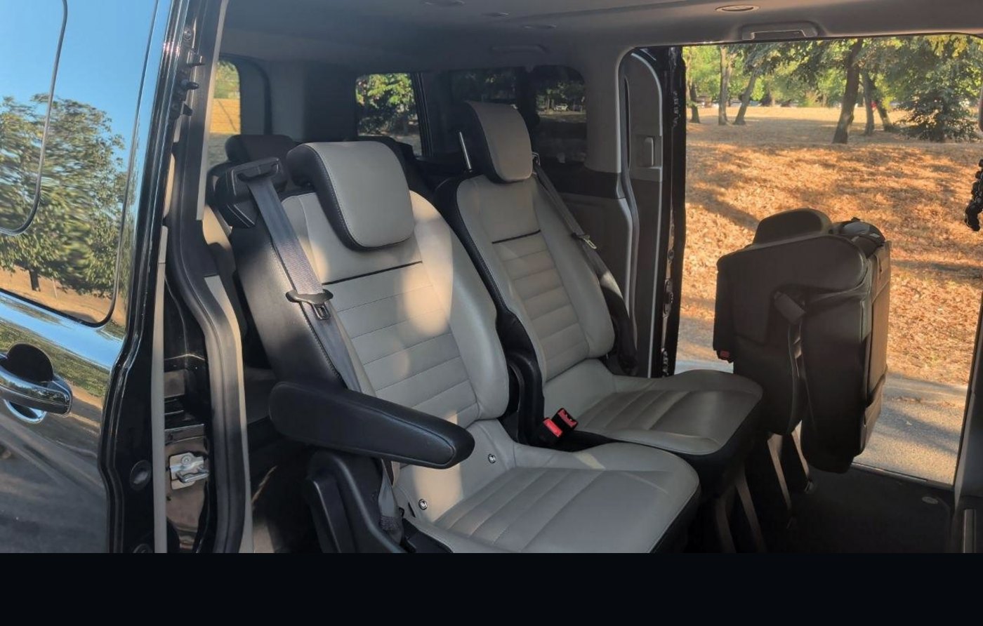 Leather rear seats of the Ford Tourneo Custom seen through the open sliding door