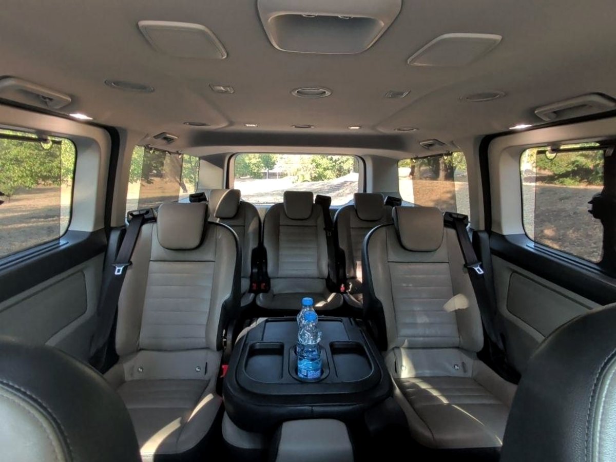 Full passenger cabin of the Ford Tourneo Custom, all three rows of leather seating