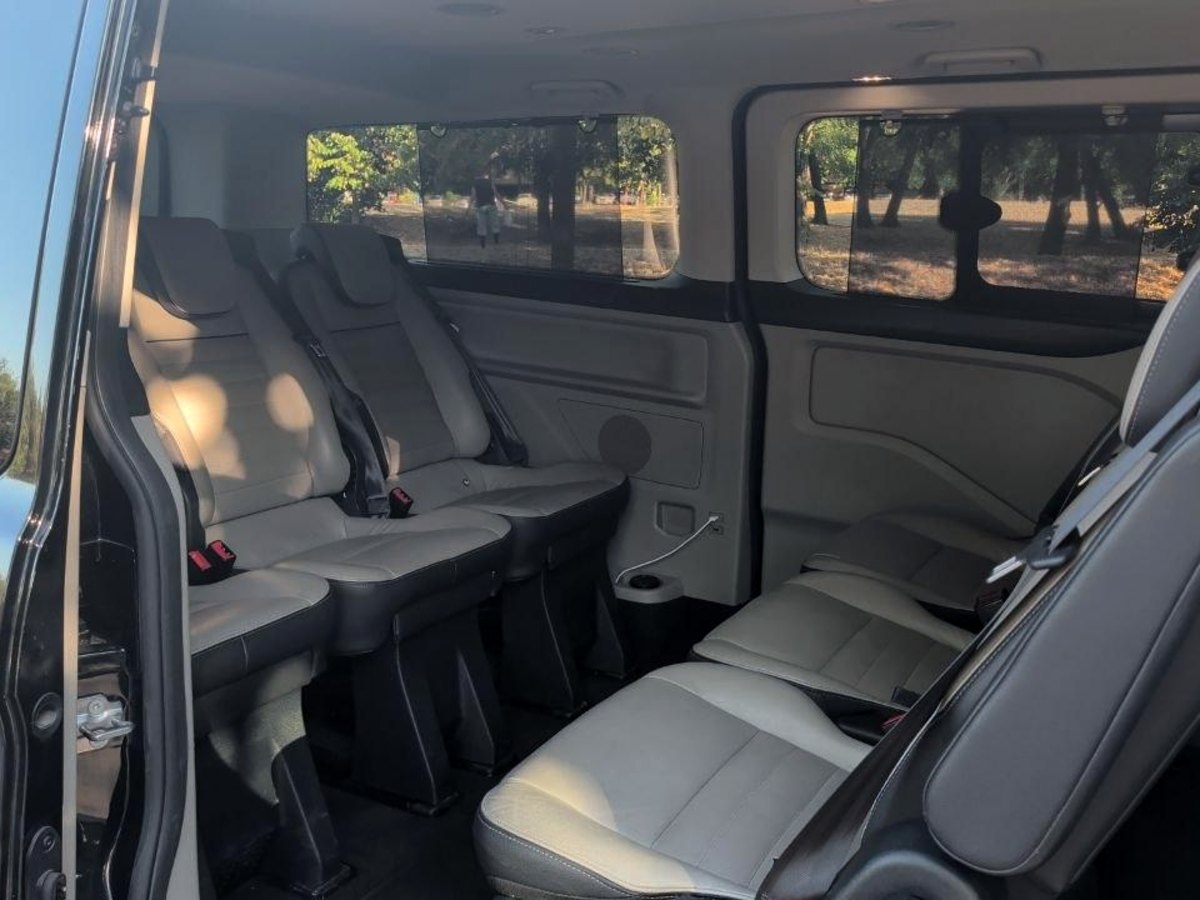 Leather rear seats of the Ford Tourneo Custom seen through the open side door